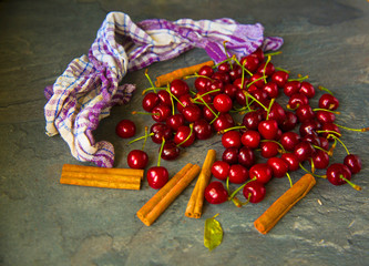 Sweet cherries on rustic wooden background