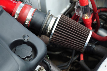 Car air filter zero resistance. element of a sports car tuning. photo toned.