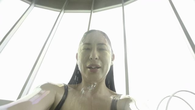 Woman sinking underwater and then reemerging