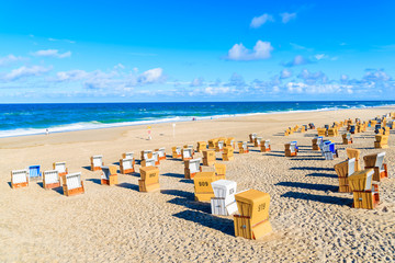 Wicker chairs on sandy beach in Wenningstedt village on Sylt island, North Sea, Germany