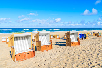 Wicker chairs on sandy beach in Wenningstedt village on Sylt island, North Sea, Germany