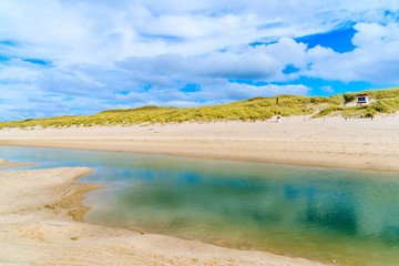 Shallow crystal clear sea water at Kampen beach at low tide, Sylt island, North Sea, Germany