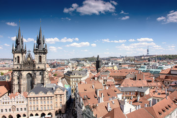 Fototapeta na wymiar Old town of Prague with beautiful houses with tiles and an old castle