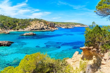Fototapeta premium Stunning view of Cala Xarraca bay with azure sea water on northern coast of Ibiza island, Spain