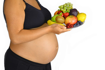 Pregnant woman with fruit bowl