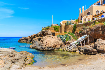 Small bay among rocks in Cala Xarraca bay, Ibiza island, Spain