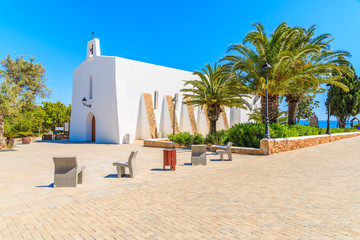 Typical white church and palm trees on square in Es Cubells village, Ibiza island, Spain © pkazmierczak
