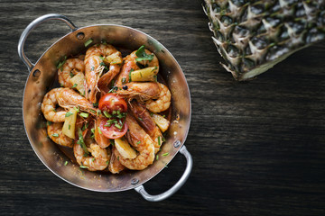 stir fry prawns in spicy asian pineapple and herbs sauce