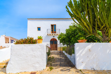 Gate to white typical house in Puig de Missa church area of Santa Eularia town, Ibiza island, Spain © pkazmierczak