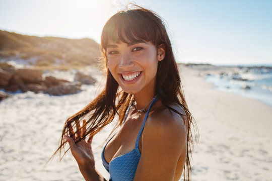Smiling young bikini woman on the beach