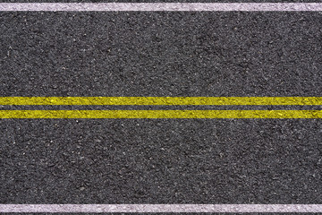 yellow and white double lines on asphalt background