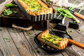 French home cooking. Casserole. Pie. quiche lorraine from puff pastry, with young green onions and...