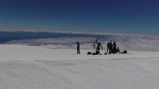 Tourists on the glacier-covered peak of Osorno Volcano, Los Lagos Region, Chile