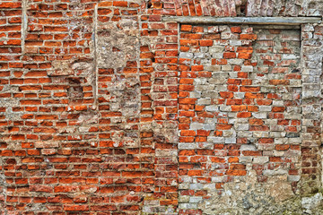 Red brick wall texture shattered by time. Grunge background