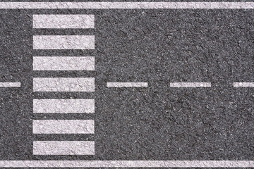 white lines and crosswalk on asphalt background texture