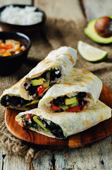 Rice black bean avocado tomato burritos