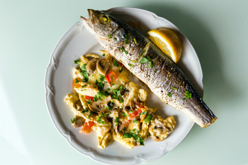 Baked fish mackerel with lemon