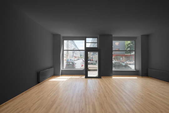 renovated store / shop - empty room with wooden floor and shopping window