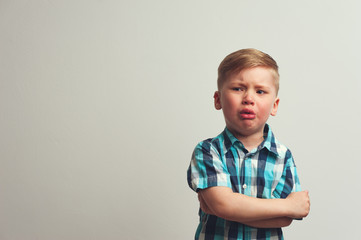 Portrait of angry caucasian child