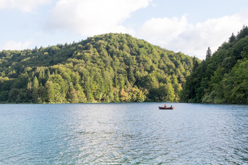 Fototapeta na wymiar canoeing on lake at Plitvice, Croatia