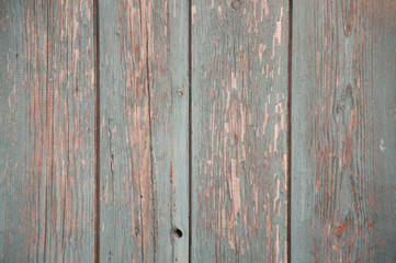Grey wooden planks with old blue paint