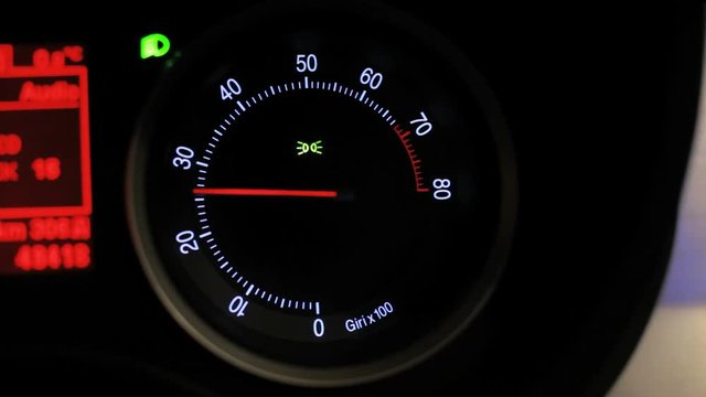 Tachometer revving. Car tachometer arrow revving. Engine rpm meter. Tachometer display. Close up of tachometer speed. Auto increases the speed. Rmp gauge