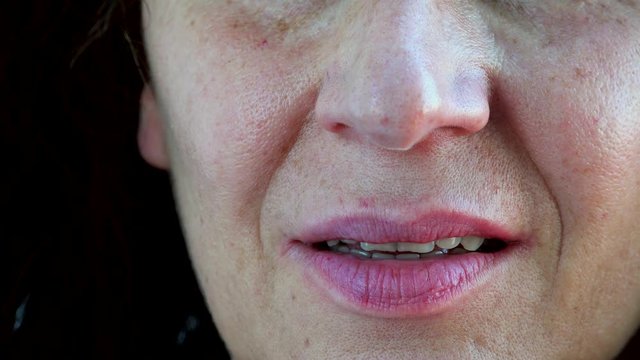 details of aged menopausal teeth of Caucasian woman with Arabic and Middle Eastern somatic traits