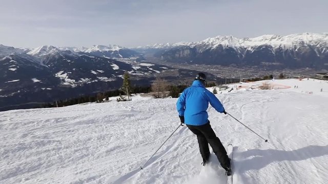 slow motion of downhill skiing, winter sport, camera follows skier