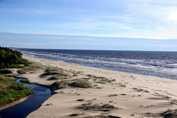 baltic sea beach with stones and waves