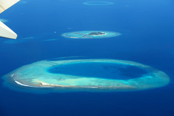 Fototapeta na wymiar Maldives islands top view from airplane
