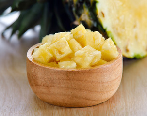 pineapple sliced on wood background