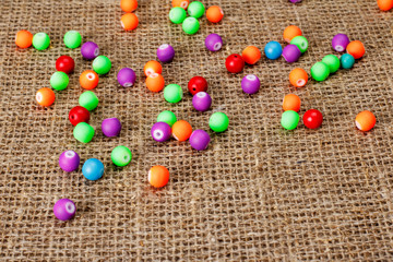 Colorful beads on a background of fabric