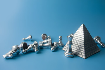silver game chess and pyramid in business concept