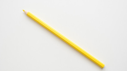 yellow color pencil on white background