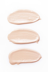 Liquid makeup foundations/blush on white background
