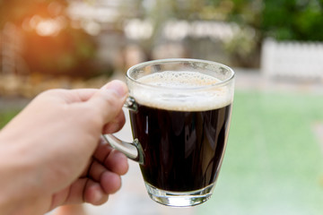 Hand holding coffee