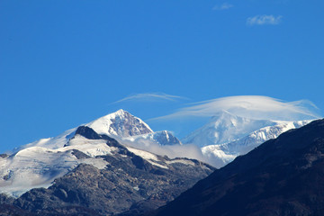 Fototapeta na wymiar Typical foehn clouds, altocumulus lenticularis lent, in the mountains, Patagonia, Chile