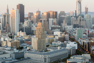 Aerial View of San Francisco Downtown and Market Street at Sunset. Seen from an elevated point in Van Ness - Civic Center neighborhood in San Francisco, California, USA.