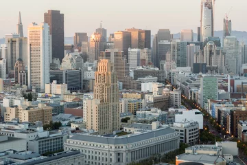 Fototapeten Aerial View of San Francisco Downtown and Market Street at Sunset. Seen from an elevated point in Van Ness - Civic Center neighborhood in San Francisco, California, USA. © Yuval Helfman