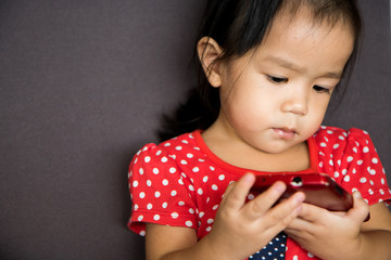 girl play mobile phone with serious emotion