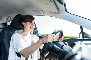 young woman driving a car.