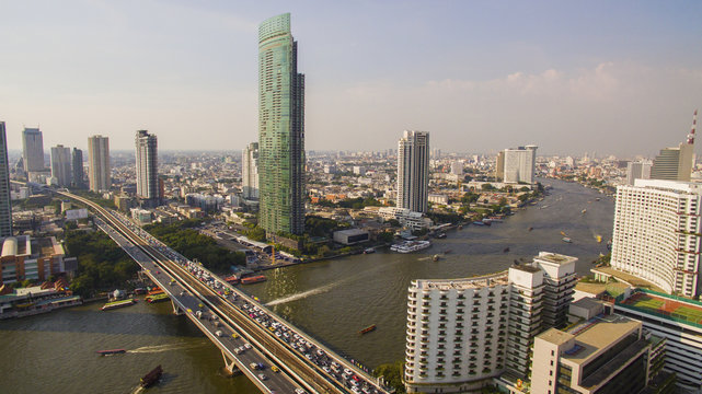 aerial view of sathorn bridge crossing chao praya river in heart of bangkok thailand