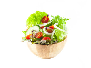vegetables salad in a wooden bowl isolated on white