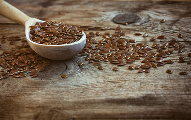 Flax seeds in wooden spoon, closeup