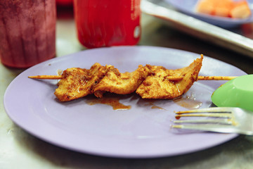 Finished pork stick with satay sauce. Satay is a dish of skewered grilled meat with Javanese origins in Malacca City, Malacca, Malaysia.
