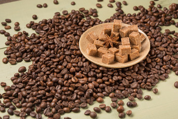 Coffee cereal scattered on the boards saucer with sugar and spices