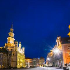 Fototapeta na wymiar Beautifully illuminated Poznan's Old Town with historic city hall. Poland