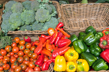 Bell pepper, tomatoes and broccoli for sale at a market