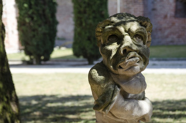 Fototapeta na wymiar Grotesque dwarf sculpture. Urgnano, Bergamo - Italy