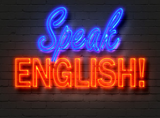 Naklejka na ściany i meble Speak English, neon sign on brick wall